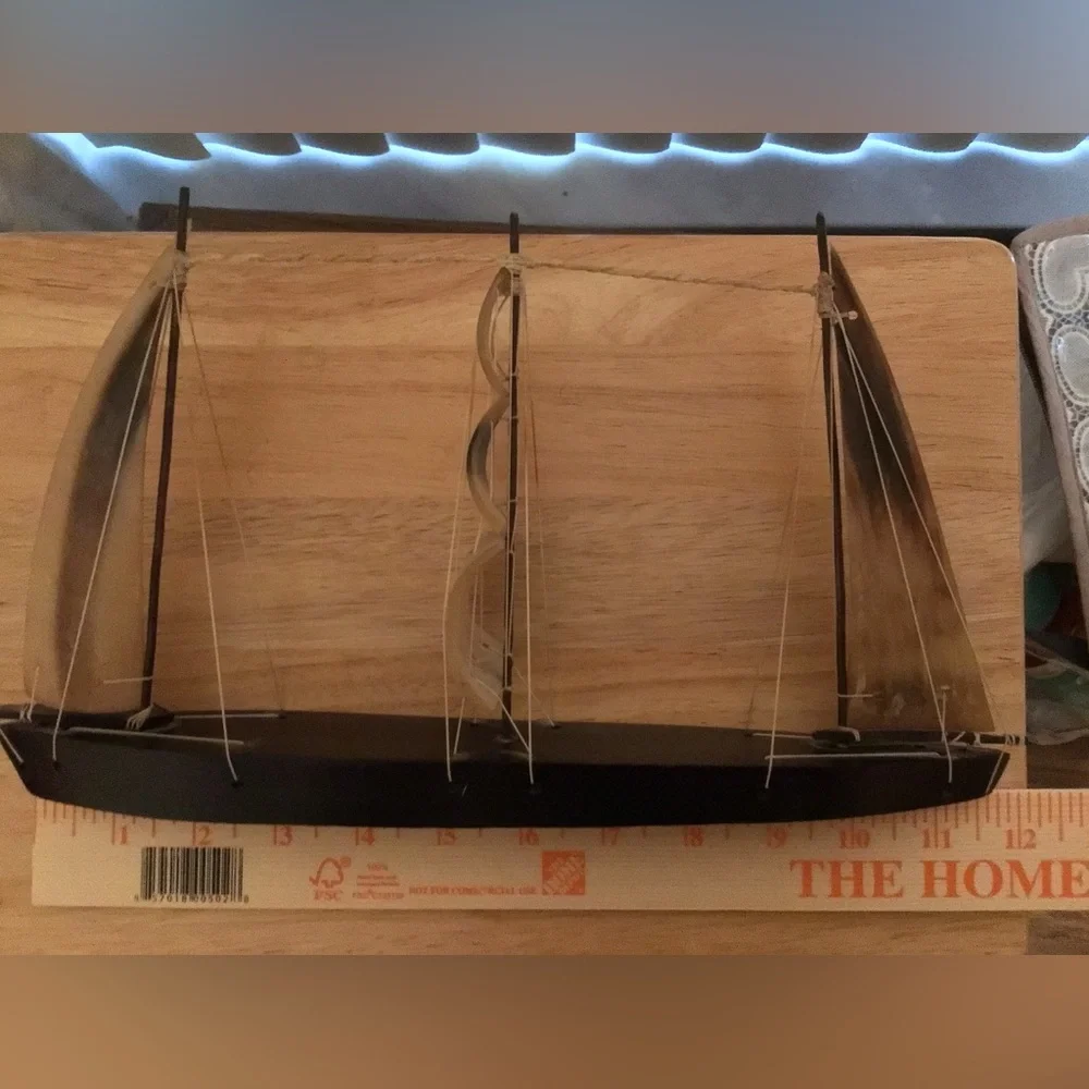 A Miniature  Decorative Black Wooden Sailboat  With Hard Plastic Three Sails